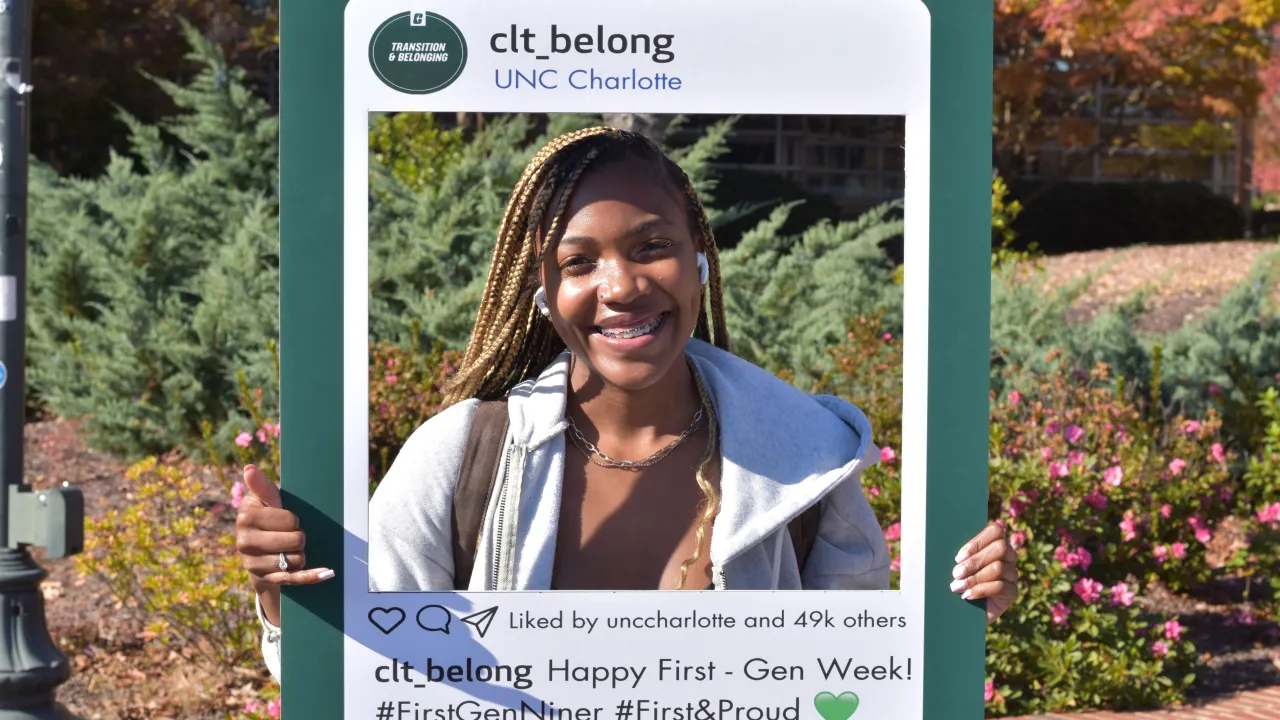 Student with photo frame during First-Gen Week Kickoff