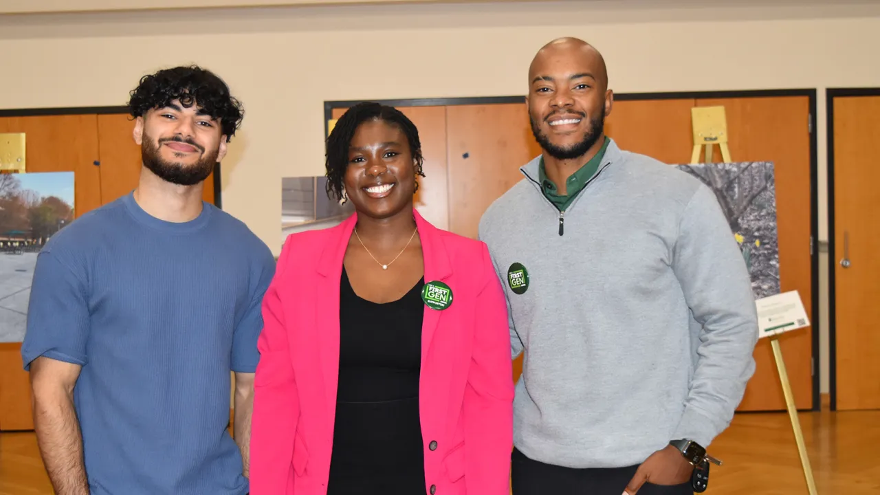 3 people standing smiling 