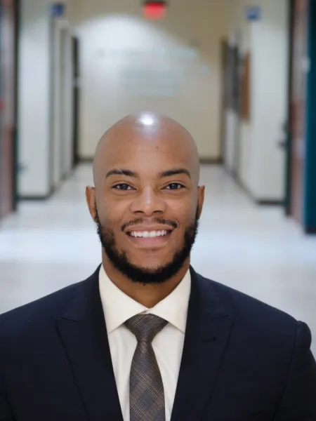 Photo of man in suit posing for headshot