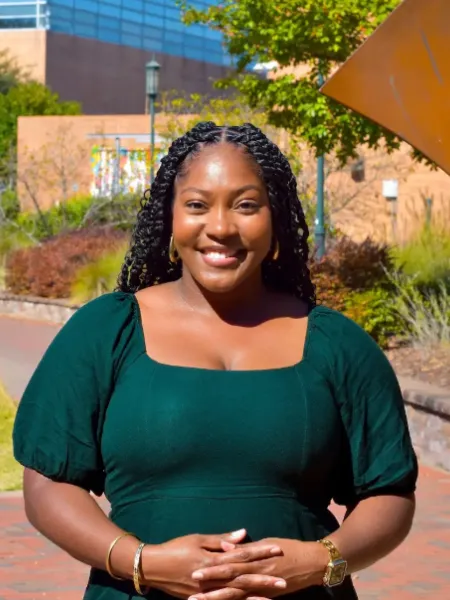 woman wearing green dress smiling