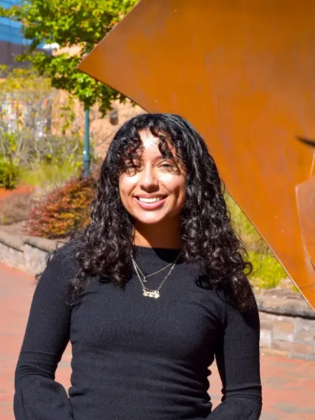 person wearing black smiling 