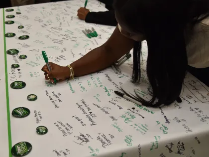 First-Gen niners signing the banner