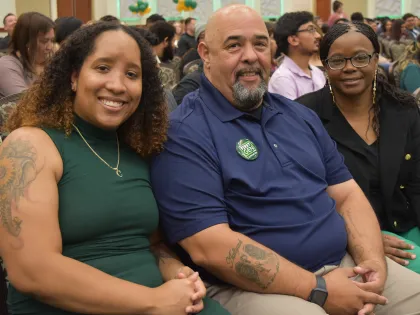 First-Generation family sitting together smiling