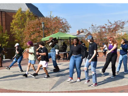 First-Generation Students line dancing at the annual cookout