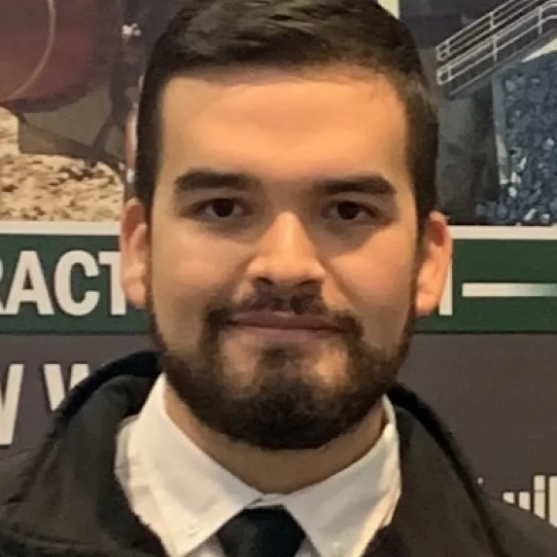 Person with a beard and black tie